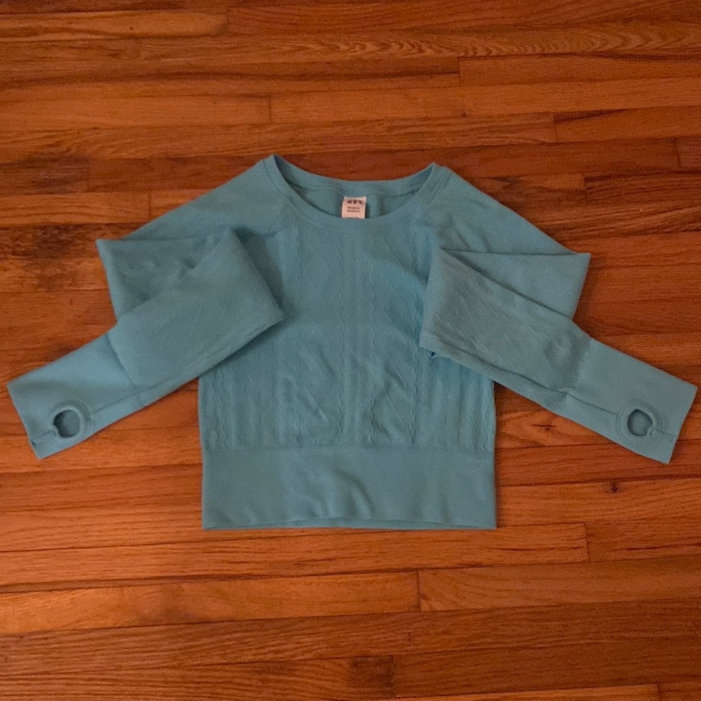 Super cute, fitted, textured, workout top. New with tags, never worn.